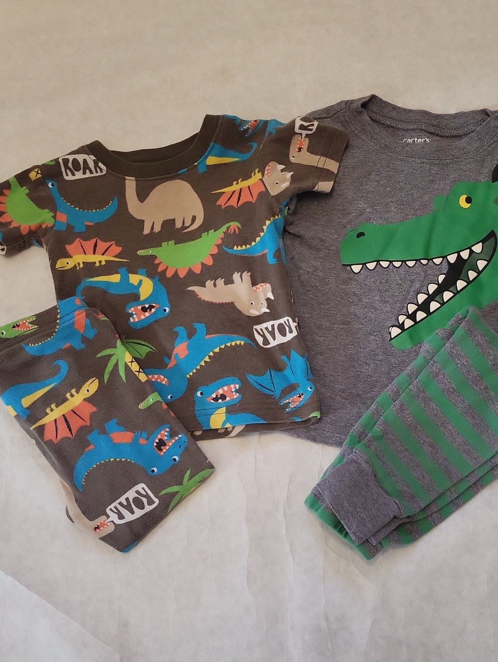 Two pair of Carter's pajama sets